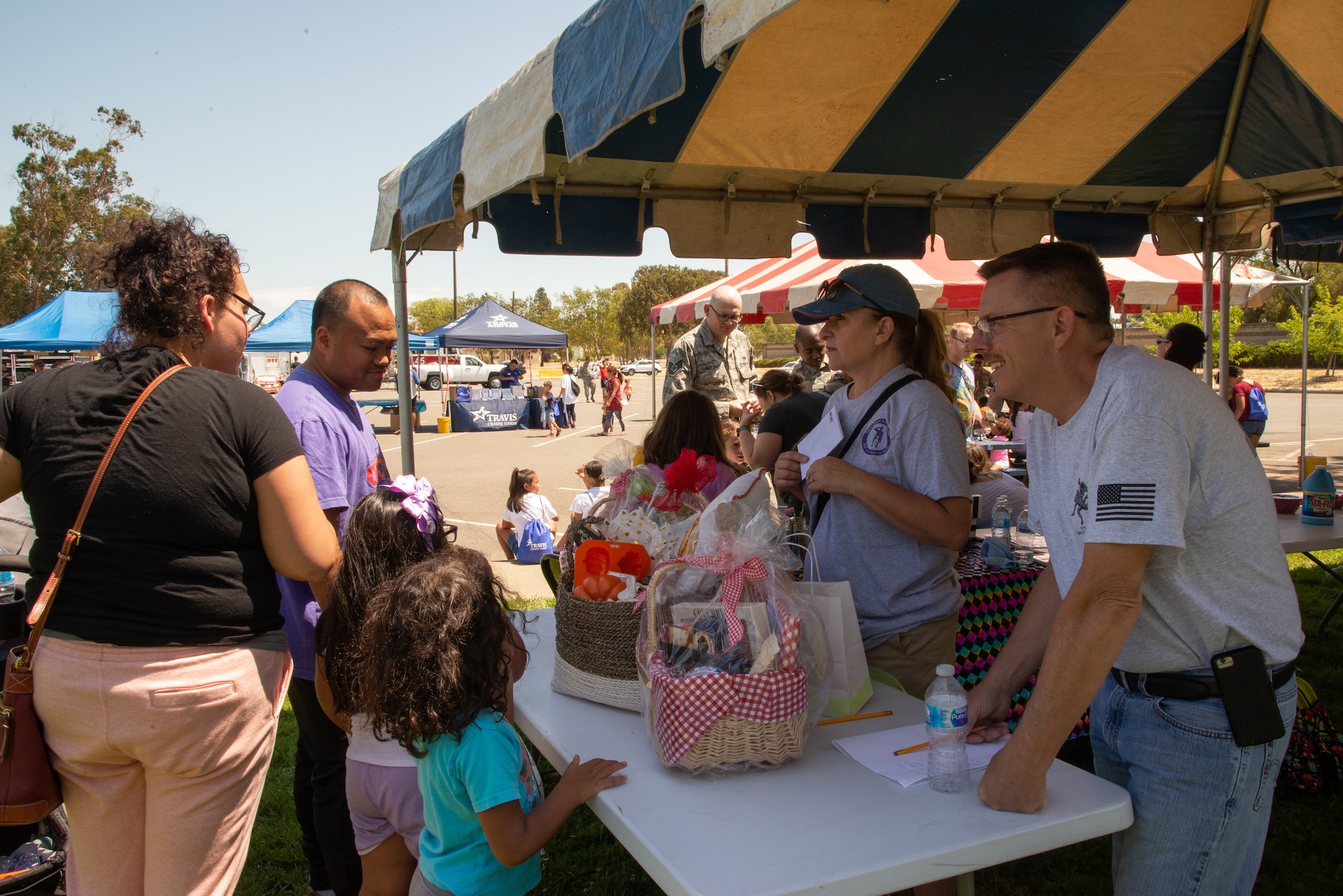349th Air Mobility Wing Airmen and their family members participate in Operation Family Circle Aug. 10, 2019, at Travis Air Force Base, Calif.