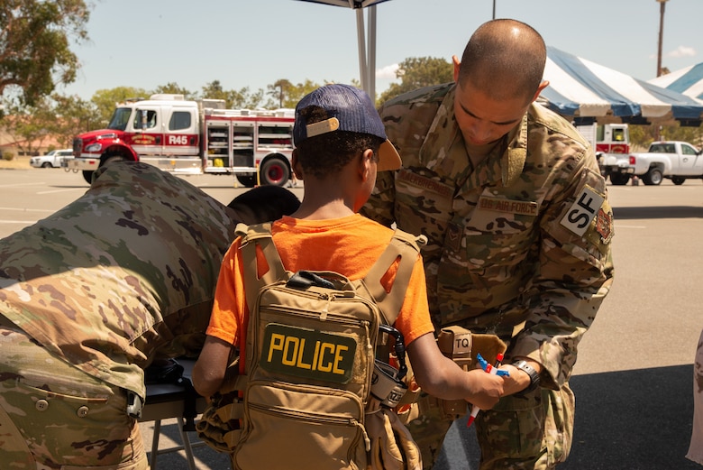 349th Air Mobility Wing Airmen and their family members participate in Operation Family Circle Aug. 10, 2019, at Travis Air Force Base, Calif.
