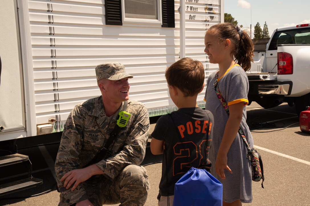 349th Air Mobility Wing Airmen and their family members participate in Operation Family Circle Aug. 10, 2019, at Travis Air Force Base, Calif.