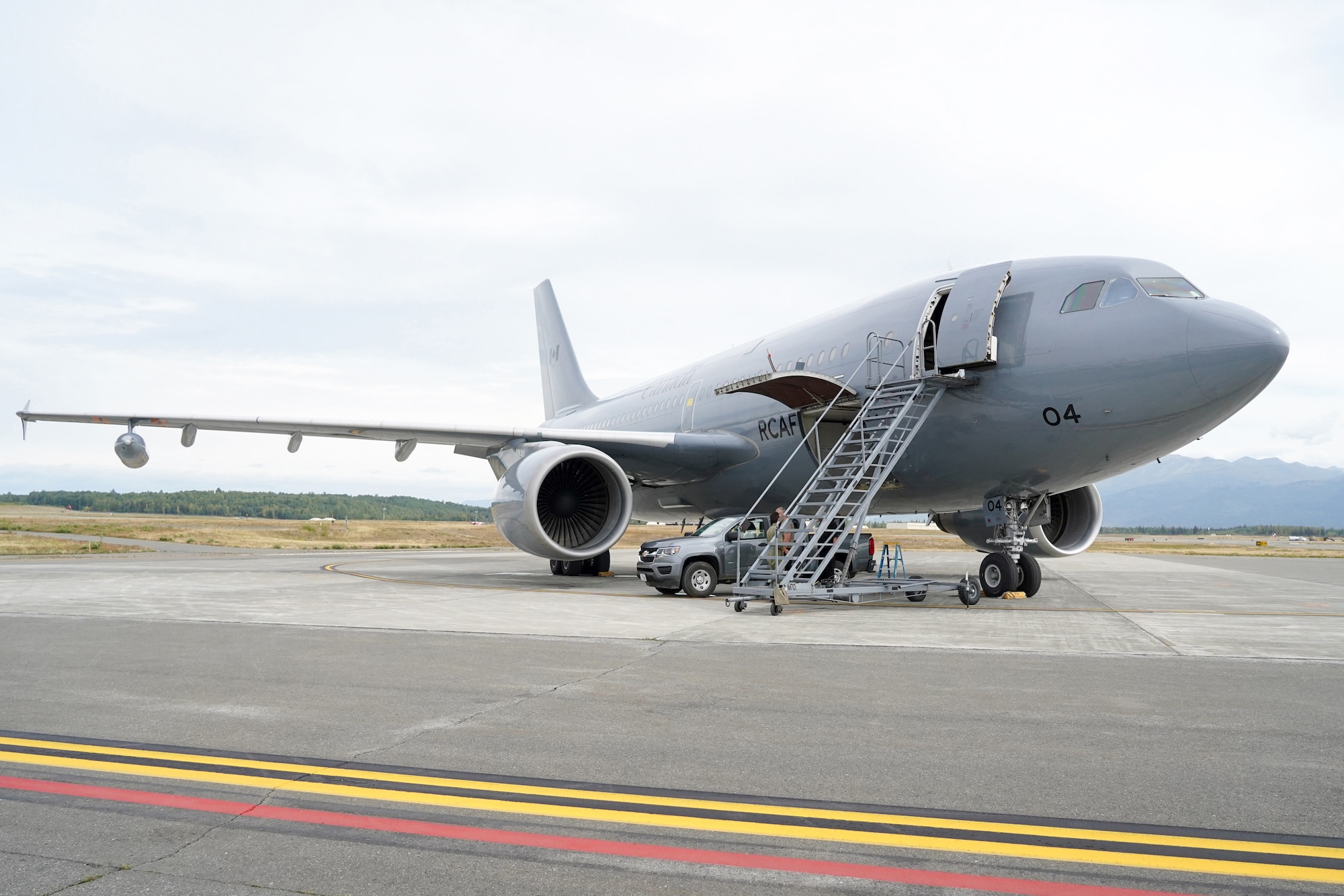 A Royal Canadian Air Force CC-150 Polaris refueling tanker of the 437th Transport Squadron based out of Canadian Forces Base Trenton, Canada, sits on the tarmac at Joint Base Elmendorf-Richardson, Alaska, before a sortie during the Red Flag-Alaska 19-3 exercise, Aug. 15, 2019. Red Flag-Alaska, a series of Pacific Air Forces commander-directed field training exercises for U.S. forces, provides joint offensive counter-air, interdiction, close air support, and large force employment training in a simulated combat environment.