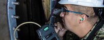 Damage Controlman Tests a Confined Space