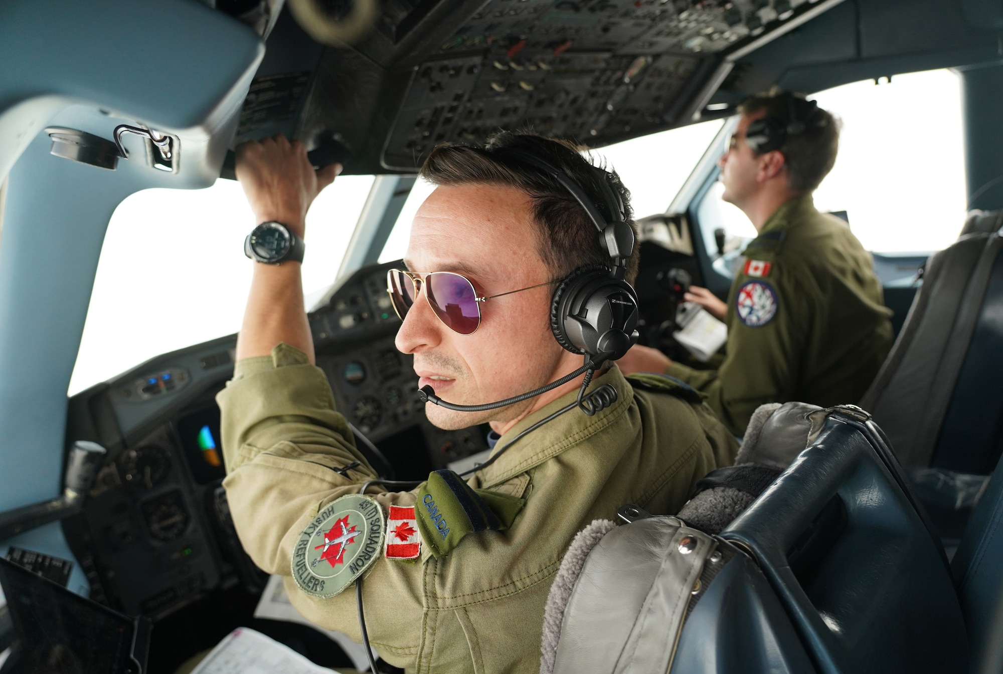 Royal Canadian Air Force captains Russ Baker, and Andrew Williams, both assigned to the 437th Transport Squadron based out of Canadian Forces Base Trenton, Canada, perform refueling operations in training airspace over Alaska during the Red Flag-Alaska 19-3 exercise, Aug. 15, 2019. Red Flag-Alaska, a series of Pacific Air Forces commander-directed field training exercises for U.S. forces, provides joint offensive counter-air, interdiction, close air support, and large force employment training in a simulated combat environment.