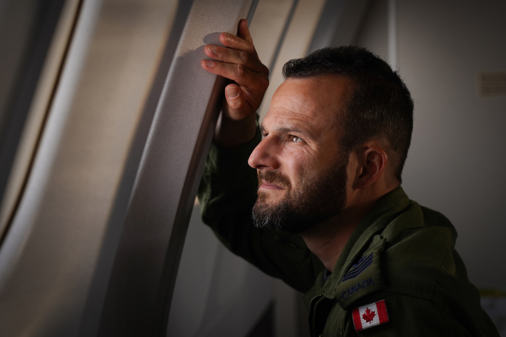 Royal Canadian Air Force Sgt. Oliver Beaudry, a loadmaster assigned to the 437th Transport Squadron based out of Canadian Forces Base Trenton, Canada, monitors refueling operations from a window of a CC-150 Polaris refueling tanker in training airspace over Alaska during the Red Flag-Alaska 19-3 exercise, Aug. 15, 2019. Red Flag-Alaska, a series of Pacific Air Forces commander-directed field training exercises for U.S. forces, provides joint offensive counter-air, interdiction, close air support, and large force employment training in a simulated combat environment.