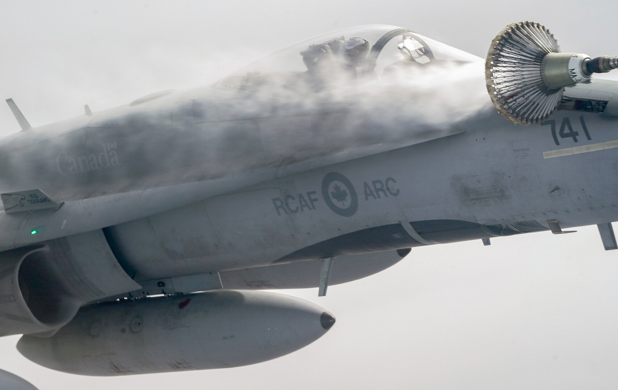 A Royal Canadian Air Force CF-18 Hornet makes initial contact with a CC-150 Polaris refueling tanker nozzle as RCAF Airmen assigned to the 437th Transport Squadron based out of Canadian Forces Base Trenton, Canada, perform refueling operations in training airspace over Alaska during the Red Flag-Alaska 19-3 exercise, Aug. 15, 2019. Red Flag-Alaska, a series of Pacific Air Forces commander-directed field training exercises for U.S. forces, provides joint offensive counter-air, interdiction, close air support, and large force employment training in a simulated combat environment.