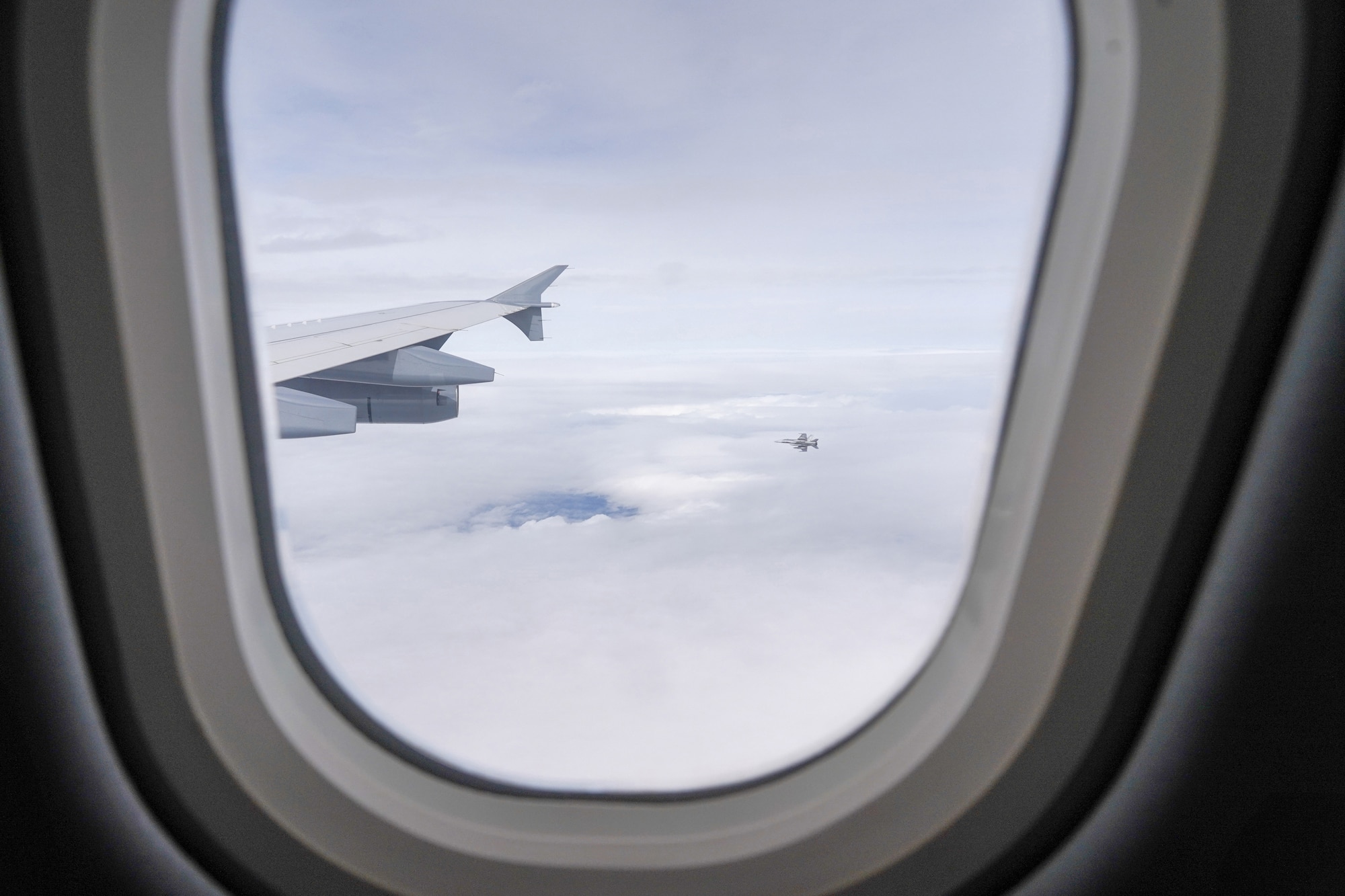 A Royal Canadian Air Force CF-18 Hornet peels away from a CC-150 Polaris refueling tanker as RCAF Airmen assigned to the 437th Transport Squadron based out of Canadian Forces Base Trenton, Canada, perform refueling operations in training airspace over Alaska during the Red Flag-Alaska 19-3 exercise, Aug. 15, 2019. Red Flag-Alaska, a series of Pacific Air Forces commander-directed field training exercises for U.S. forces, provides joint offensive counter-air, interdiction, close air support, and large force employment training in a simulated combat environment.