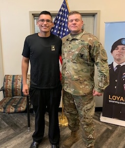 Luis Enrique Pinto Jr. with his recruiter, Staff Sgt. Philip Long. Luis lost 113 pounds in seven months in order to pass the Army's weight requirements.