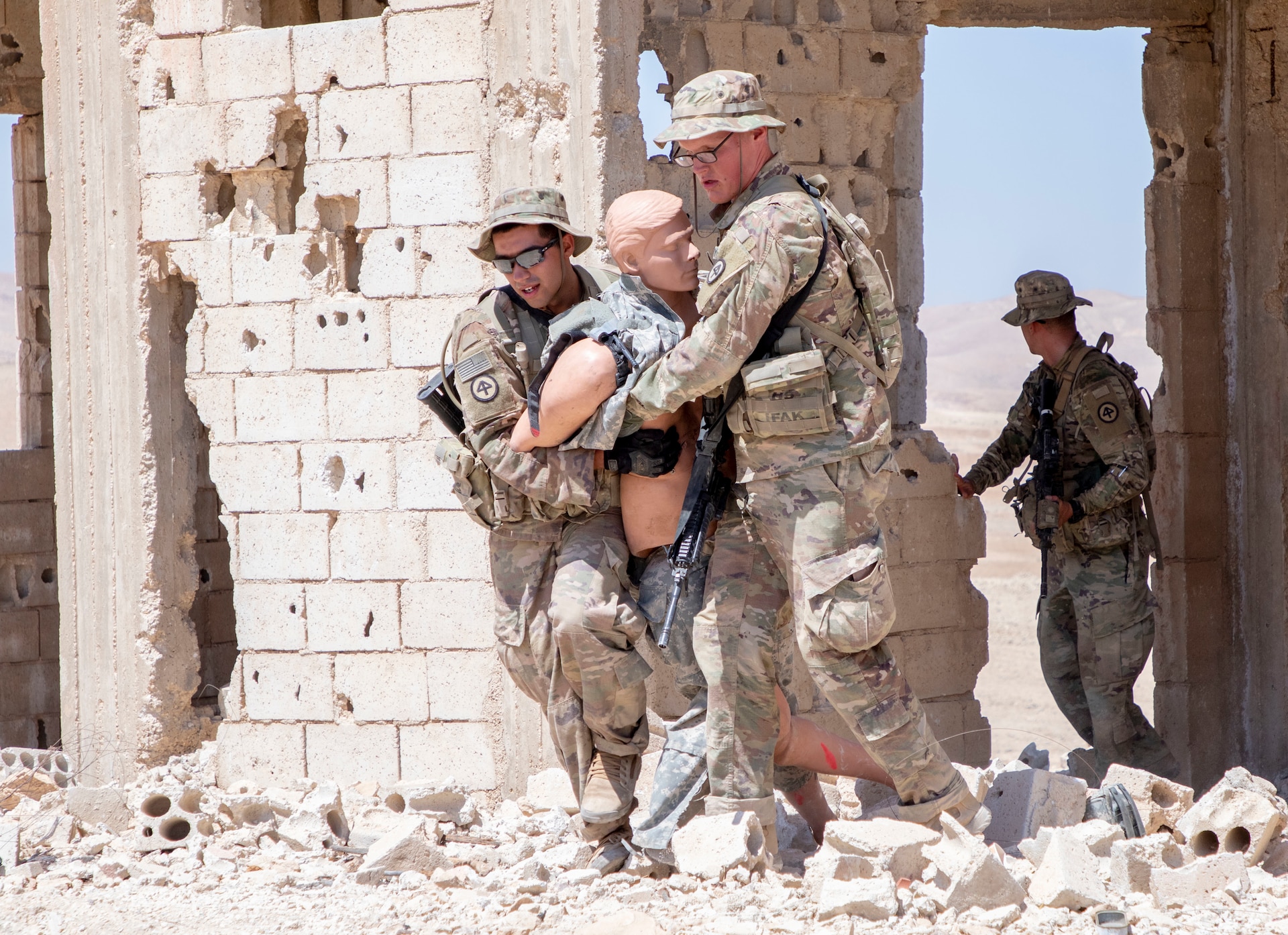 Spur candidates with 1st Squadron, 102nd Cavalry Regiment, 44th Infantry Brigade Combat Team of the 42nd Infantry Division, New Jersey National Guard, move a simulated casualty to safety during a Spur Ride at Joint Training Center-Jordan August 11, 2019. The Army’s first priority is readiness - ensuring Soldiers have the tools and training needed to be lethal and ready to fight and win.