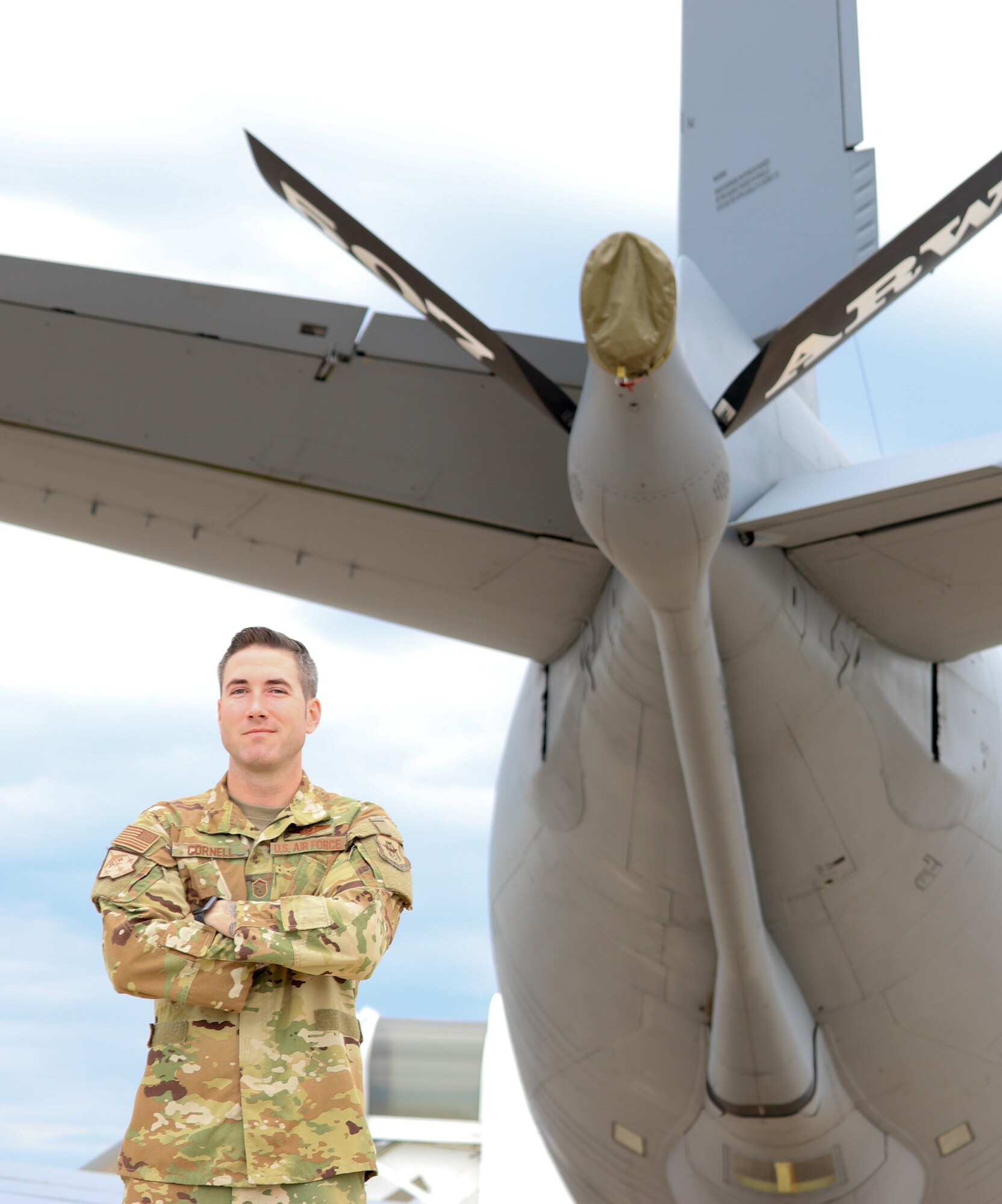 Master Sgt. Ryan Cornell, 465th Air Refueling Squadron boom operator, stands by a 507th Air Refueling Wing KC-135R Stratotanker, Aug. 13, 2019, at Tinker Air Force Base, Oklahoma. The Air Force Recruiting Service was there to film Cornell to highlight enlisted aircrew career fields. (U.S. Air Force photo by Senior Airman Mary Begy)
