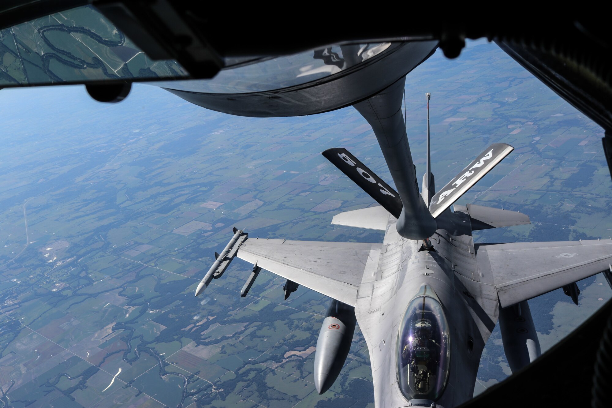 A 138th Fighter Wing F-16 Fighting Falcon receives fuel from a 507th Air Refueling Wing KC-135R Statotanker during a congressional orientation flight, Aug. 15, 2019, at Tinker Air Force Base, Oklahoma. The Okies shared the Reserve mission and a unique experience with the congressional delegation. (U.S. Air Force photo by Senior Airman Mary Begy)