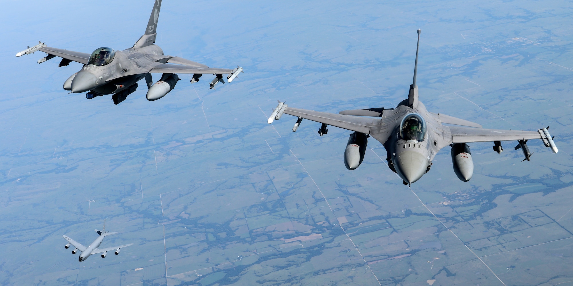 Two 138th Fighter Wing F-16 Fighting Falcons and a 507th Air Refueling Wing KC-135R Statotanker fly behind 507th ARW tanker during a congressional orientation flight, Aug. 15, 2019, at Tinker Air Force Base, Oklahoma. The Okies shared the Reserve mission and a unique experience with the congressional delegation. (U.S. Air Force photo by Senior Airman Mary Begy)