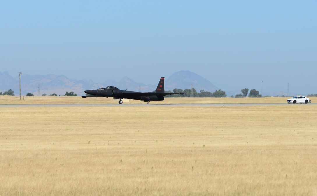 A U-2 Dragon Lady performs a touch and go with a chase car following June 20, 2018, at Beale Air Force Base, California. The driver of the chase car is in constant contact with the U-2 pilot to help him safely land the aircraft.