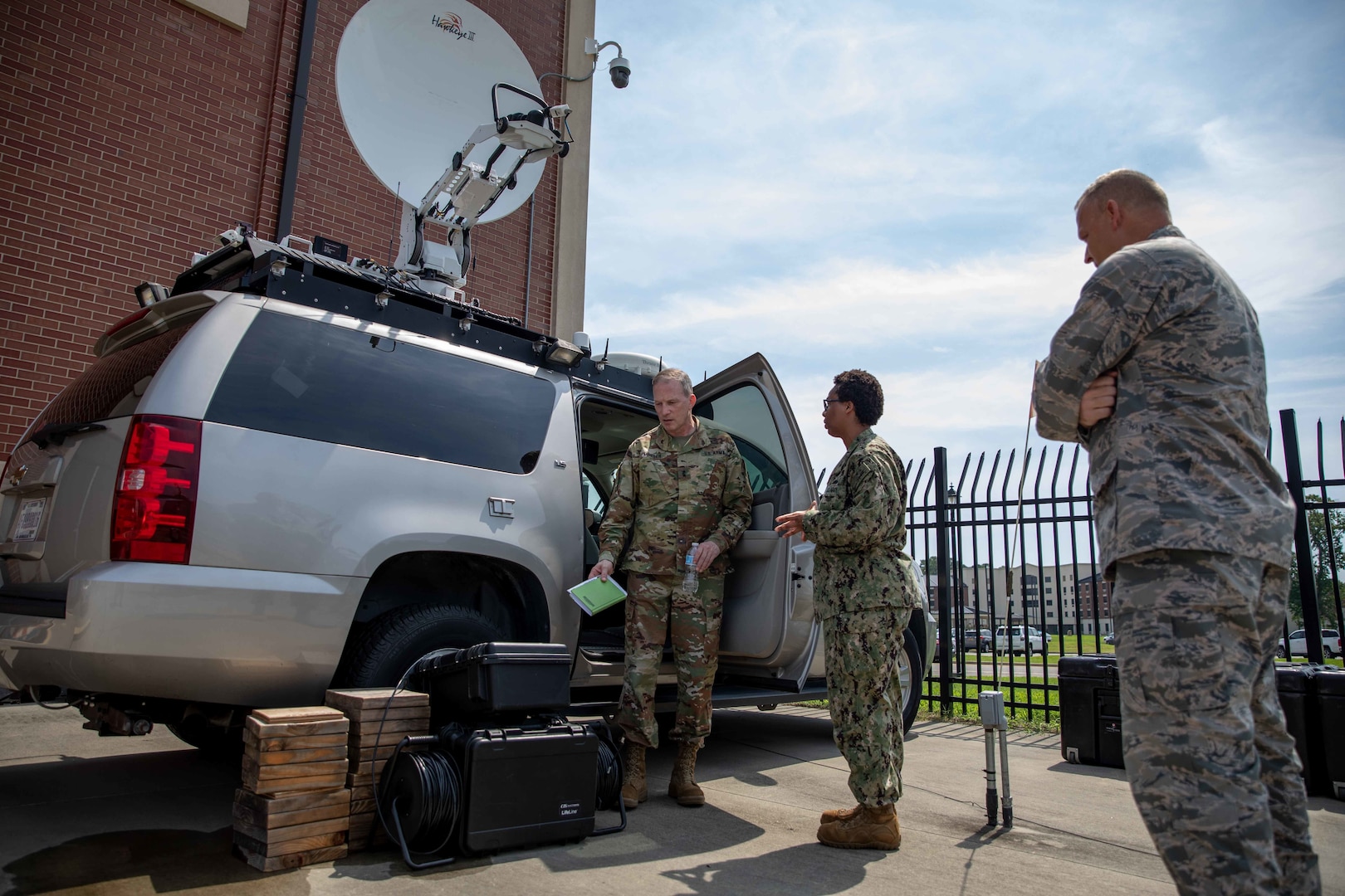 Army Maj. Gen. Greg Mosser, commanding general of the 377th Theater Sustainment Command, tours Joint Task Force Civil Support (JTF-CS) Headquarters’ communications department, receiving a brief from Navy Information Systems Technician 1st Class Angelica Mathis.