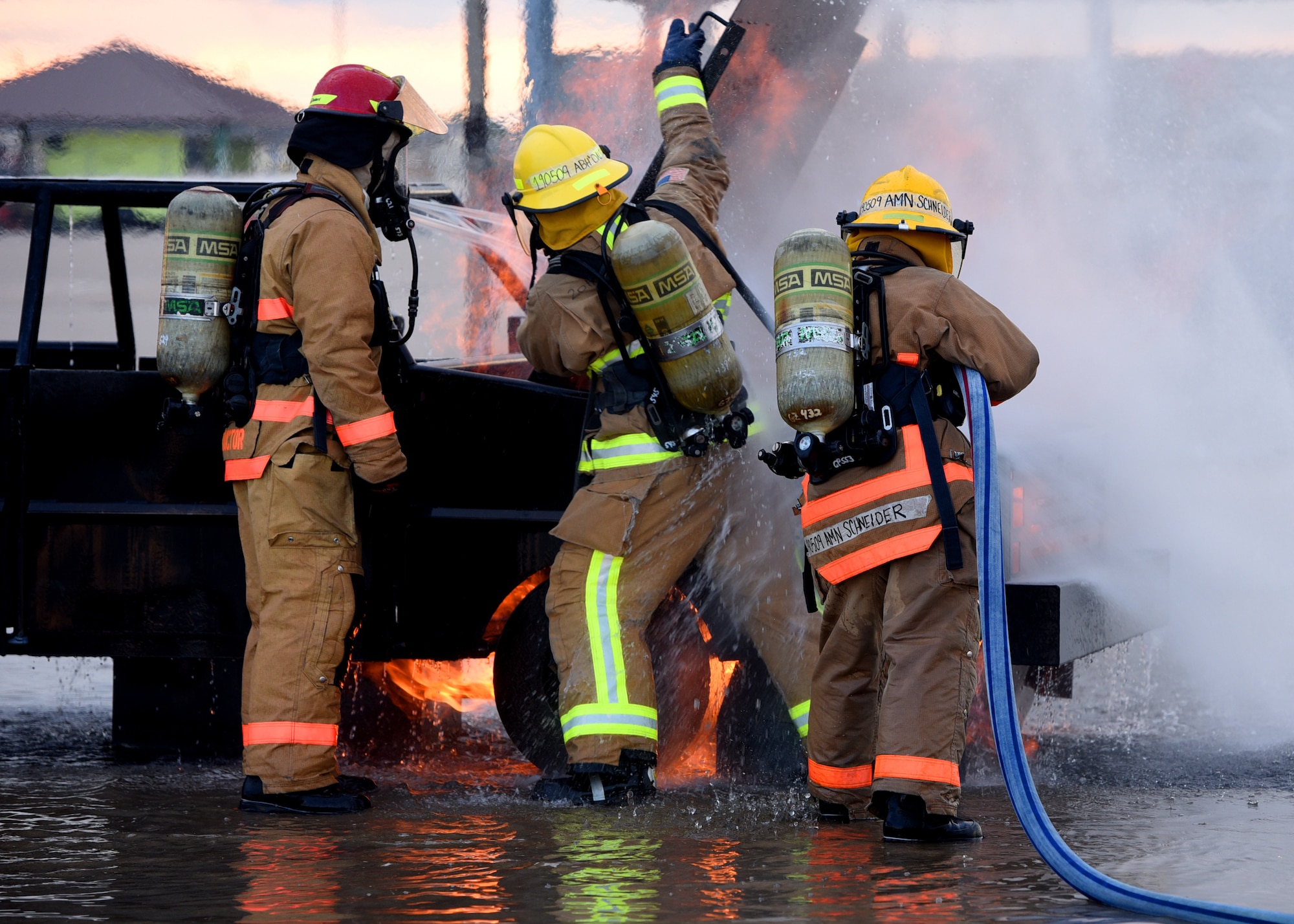 U.S. Air Force Airman Kristina Schneider, 312th Training Squadron student, utilizes different water spraying techniques to direct the fire hose to put out a simulated vehicle fire outside the Louis F. Garland Department of Defense Fire Academy on Goodfellow Air Force Base, Texas, July 11, 2019. As part of Goodfellow’s joint mission, this specific course educates 10 Air Force students, three Army students, one Navy student, and one Coast Guard student in a consolidated learning environment. (U.S. Air Force Photo by Airman 1st Class Abbey Rieves/Released