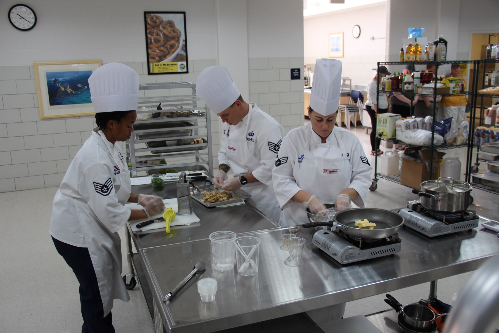 Staff Sgt. Cherise Hood (left), Staff Sgt. Joshua Parnell (middle) and Senior Airman Alyssa Ross (right), assigned to the 36th Force Support Squadron, represented Joint Region Marianas at the Tenth Annual Commander, Navy Installations Command (CNIC) Culinary Competition July 25, 2019 at Naval Station Great Lakes, Ill.