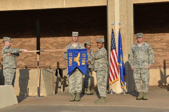 U.S. Air Force Lt. Col. Shaun Westphaul, 17th Operational Medical Readiness Squadron commander, and Col. Lauren Byrd, 17th Medical Group commander, unfurl the guidon, signifying the activation of the new squadron during the reorganization ceremony at the Ross Clinic on Goodfellow Air Force Base, Texas, August 15, 2019. During the ceremony the 17th Medical Operations Squadron was re-designated to become the 17th Operational Medical Readiness Squadron. (U.S. Air Force photo by Senior Airman Seraiah Wolf/Released)