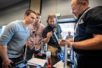 PSNS & IMF employees view a demonstration of tools during a technology showcase hosted by the National Center for Manufacturing Science at the Kitsap Conference Center July 25. More than 50 companies displayed equipment, tools, supplies and safety gear to more cost-effectively and efficiently help shipyard workers maintain, modernize and retire the Navy’s fleet.