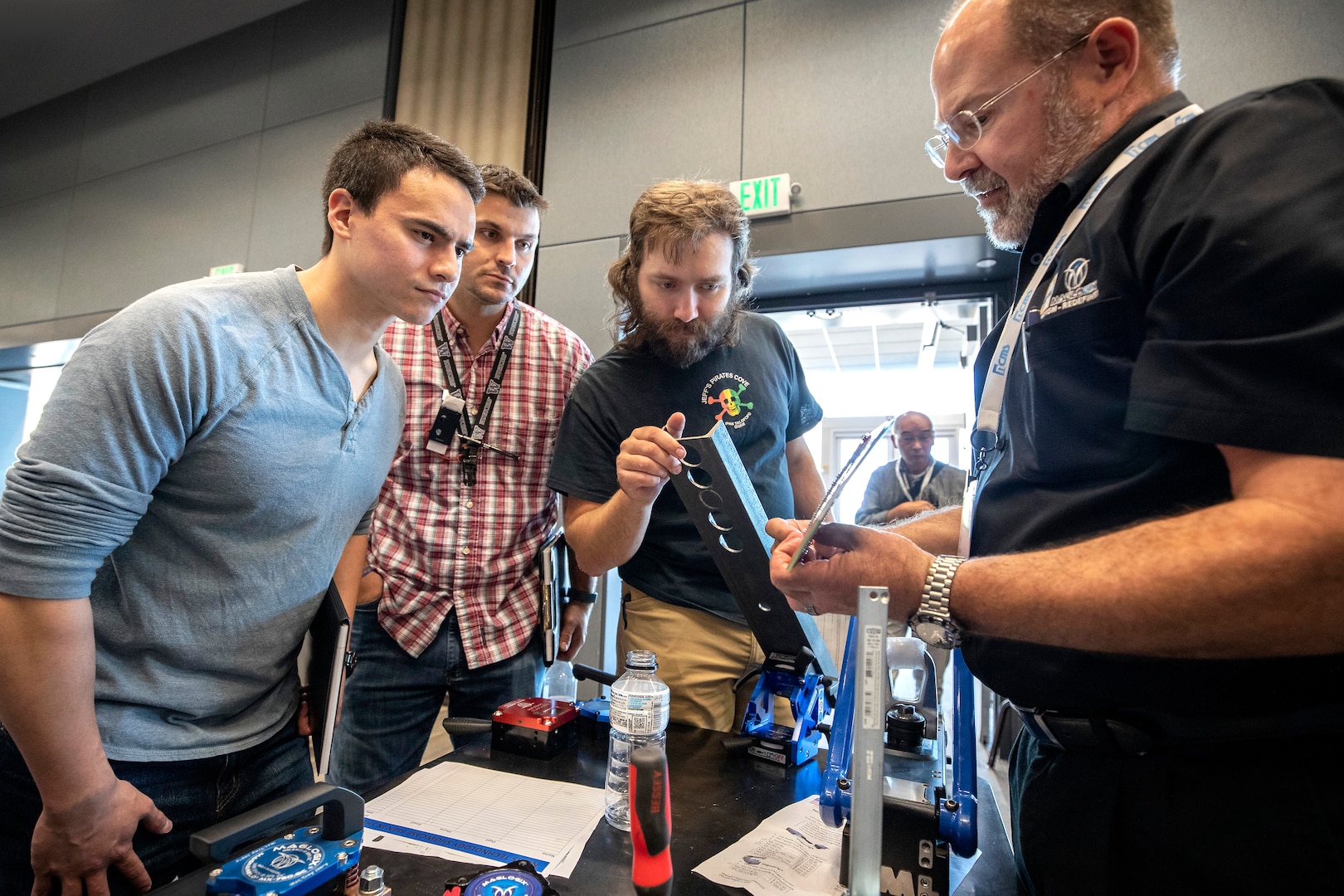 PSNS & IMF employees view a demonstration of tools during a technology showcase hosted by the National Center for Manufacturing Science at the Kitsap Conference Center July 25. More than 50 companies displayed equipment, tools, supplies and safety gear to more cost-effectively and efficiently help shipyard workers maintain, modernize and retire the Navy’s fleet.