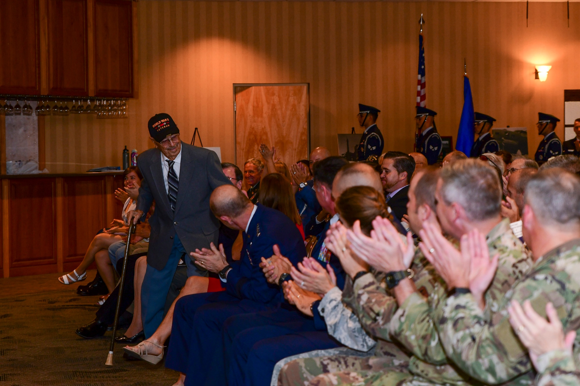 a photo of Walter Ram preparing to give a speech as he receives a purple heart