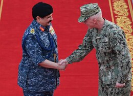 190819-N-KZ419-1068 MANAMA, Bahrain (Aug. 19, 2019) His Majesty, King Hamad bin Isa Al Khalifa, the King of the Kingdom of Bahrain, left, and Vice Adm. Jim Malloy, commander of U.S. Naval Forces Central Command, U.S. 5th Fleet, right, shake hands during a visit to discuss operations in the U.S. 5th Fleet area of operations. The King was accompanied by two of his sons, His Highness Maj. Gen. Shaikh Nasser bin Hamad Al-Khalifa, commander of the Bahraini Royal Guard, and His Highness Lt. Col. Shaikh Khaled bin Hamad Al Khalifa, commander of the Bahraini Royal Guard Rapid Intervention Force along with other top Bahraini military leaders. Bahrain has been a partner with the United States in regional maritime security for more than 70 years. (U.S. Navy photo by Mass Communication Specialist 3rd Class Dawson Roth/Released)