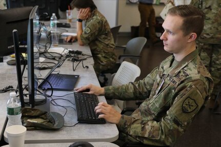 First Lt. Austin Jones, assigned to the Virginia National Guard's 91st Cyber Brigade, monitors the flow of exercise traffic through the ShadowNet platform during Cyber Yankee 19 Aug. 7, 2019, in Pembroke, New Hampshire.