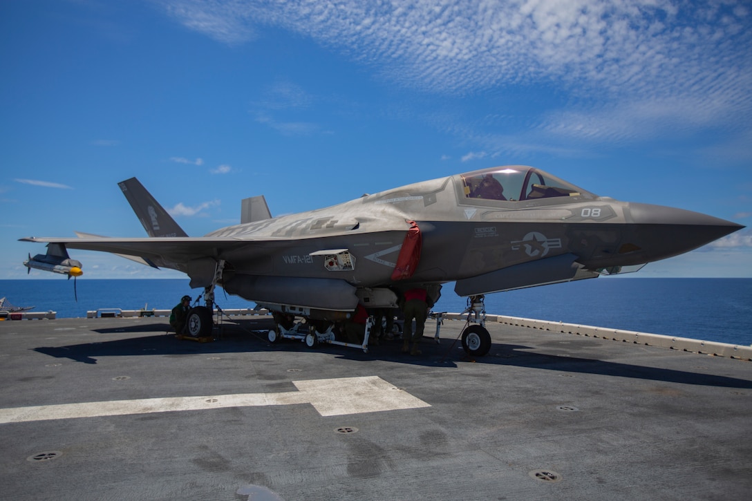 Ordnance Marines with Marine Medium Tiltrotor Squadron 265, 31st Marine Expeditionary Unit, load a Joint Direct Attack Munition onto an F-35B Lightning II fighter aircraft, aboard the amphibious assault ship USS Wasp, Pacific Ocean, August 7, 2019. Wasp, flagship of the Wasp Amphibious Ready Group, with embarked 31st MEU, is operating in the Indo-Pacific region to enhance interoperability with partners and serve as ready-response force for any type of contingency, while simultaneously providing a flexible and lethal crisis response force ready to perform a wide range of military operations.