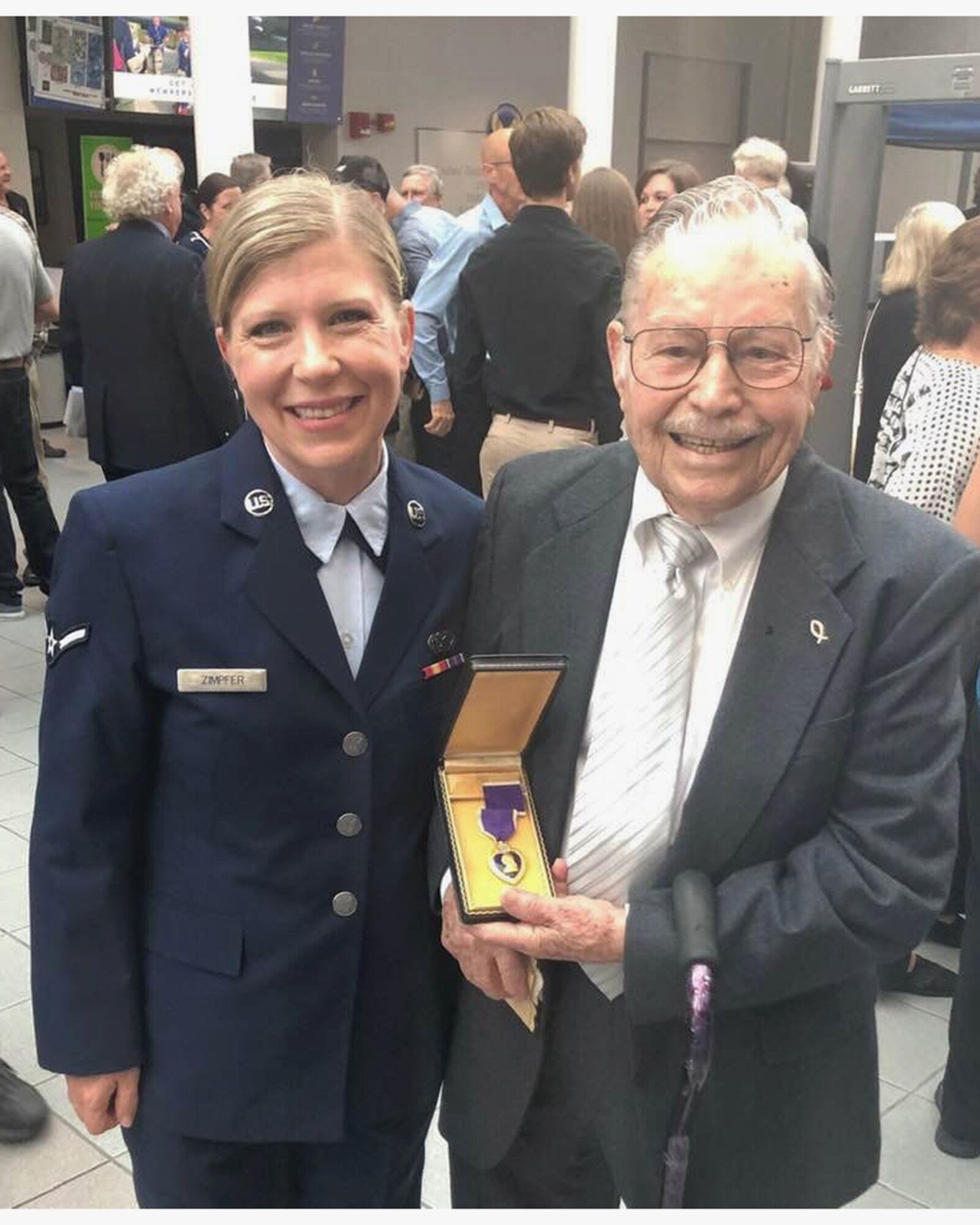 Airman Erin Zimpfer, 445th Airlift Wing Public Affairs, poses with Army veteran Albert Carr, during the Ford Oval of Honor held at the National Museum of the U.S. Air Force June 20, 2019. Mr. Carr received two Purple Hearts during his military career for his meritorious service during the second Great War.