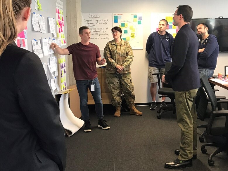 A coding team with the Air Force Business Enterprise Systems Directorate discusses a mobile app they are developing for the Air Force during a recent huddle in Atlanta. Business and Enterprise Systems Product Innovation - or BESPIN – based at the Maxwell Air Force Base Gunter Annex, Alabama, is teaming with the Air Force Installation and Mission Support Center Innovation Office to develop applications that will help Airmen do their jobs better and stay connected to their military community.