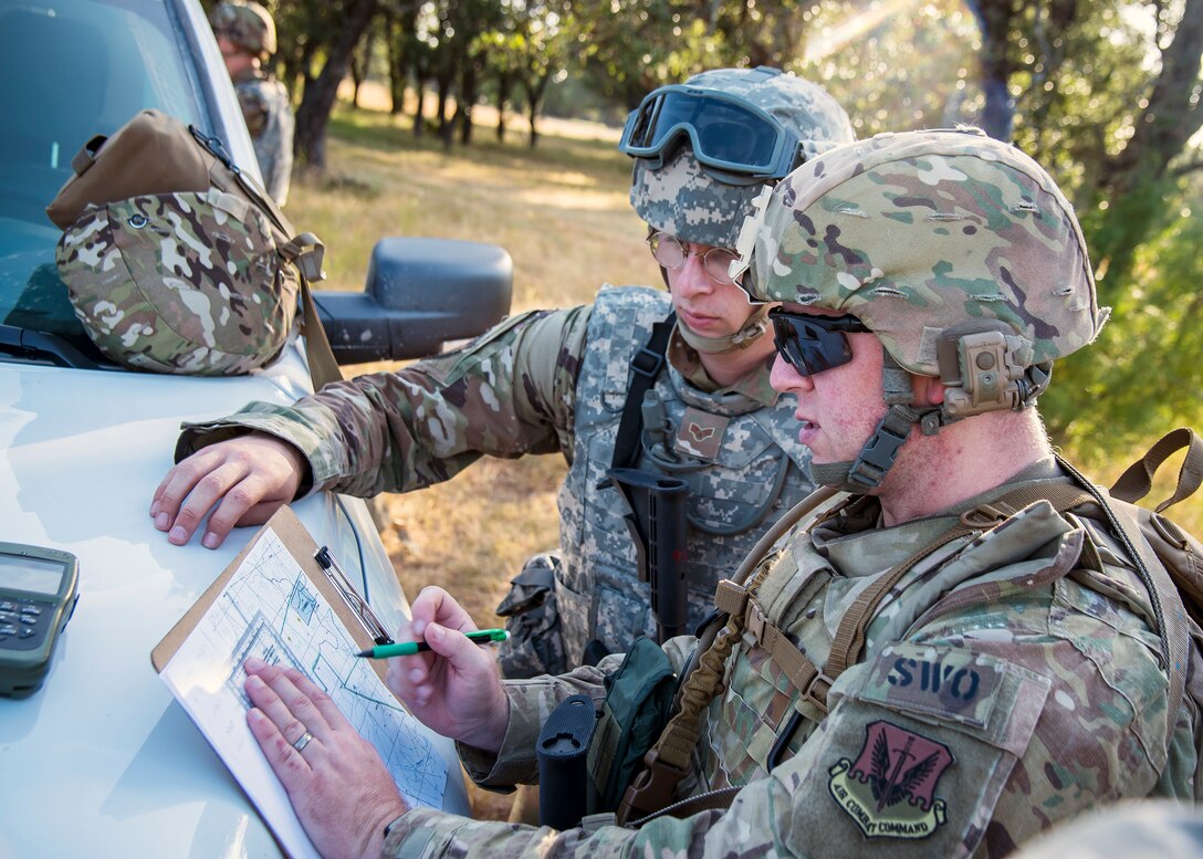 Staff Weather Officers from the 3d Weather Squadron, plot out coordinates during a certification field exercise (CFX), July 31, 2019, at Camp Bowie Training Center, Texas. The CFX was designed to evaluate the squadron’s overall tactical ability and readiness to provide the U.S. Army with full spectrum environmental support to the Joint Task Force (JTF) fight. The CFX immersed Airmen into all the aspects of what could come with a deployment such as Land Navigation. (U.S. Air Force photo by Airman 1st Class Eugene Oliver)