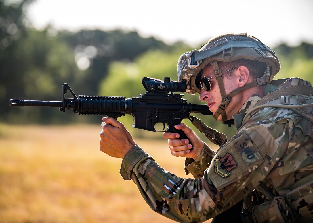 Airman 1st Class Mark Dunlop, 3d Weather Squadron weather forecaster, looks down the sight of his M4 Carbine during a certification field exercise (CFX), July 31, 2019, at Camp Bowie Training Center, Texas. The CFX was designed to evaluate the squadron’s overall tactical ability and readiness to provide the U.S. Army with full spectrum environmental support to the Joint Task Force (JTF) fight. The CFX immersed Airmen into all the aspects of what could come with a deployment such as Land Navigation. (U.S. Air Force photo by Airman 1st Class Eugene Oliver)