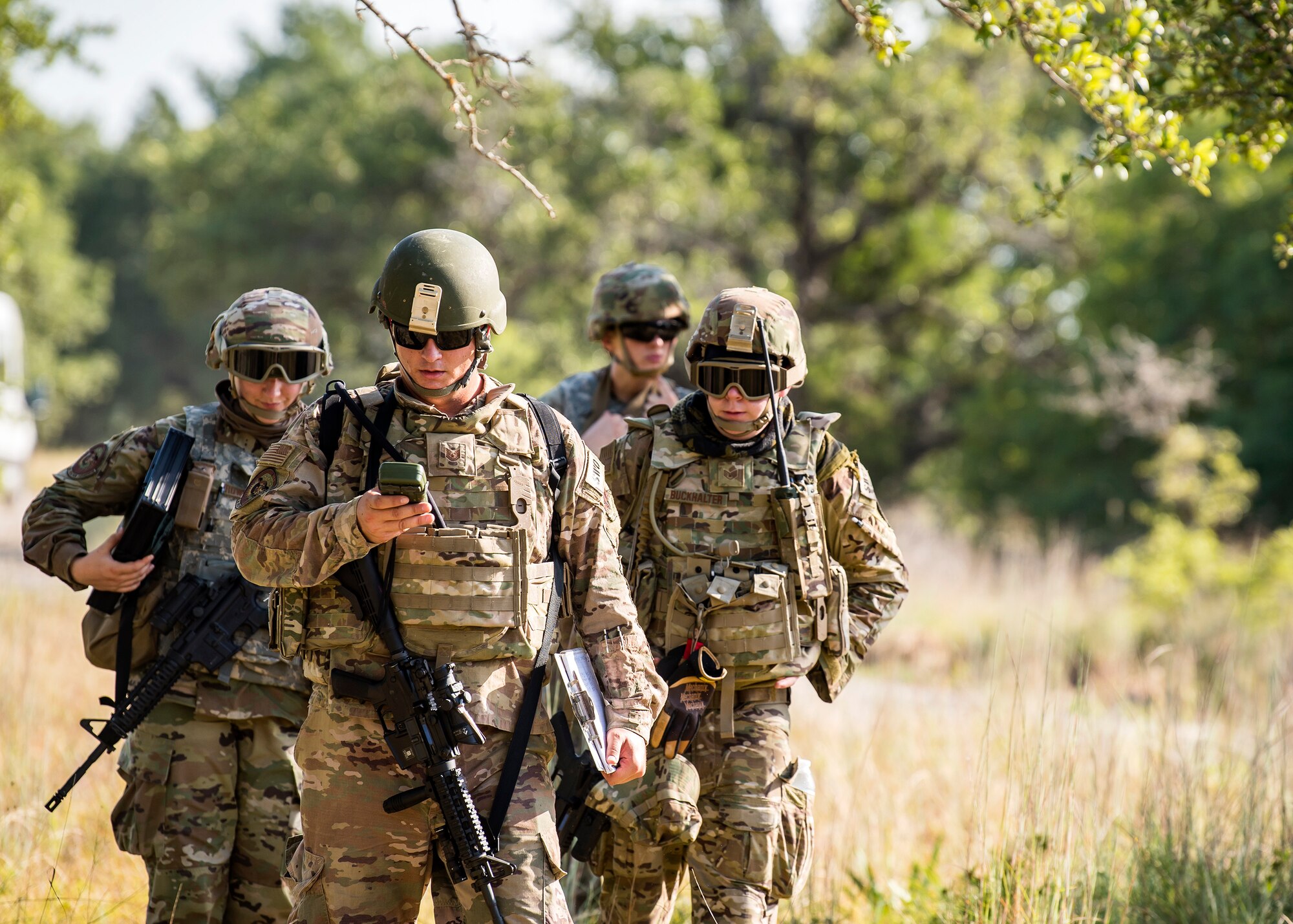 Staff Weather Officers from the 3d Weather Squadron, attempt to locate a check point during a certification field exercise (CFX), July 31, 2019, at Camp Bowie Training Center, Texas. The CFX was designed to evaluate the squadron’s overall tactical ability and readiness to provide the U.S. Army with full spectrum environmental support to the Joint Task Force (JTF) fight. The CFX immersed Airmen into all the aspects of what could come with a deployment such as Land Navigation. (U.S. Air Force photo by Airman 1st Class Eugene Oliver)