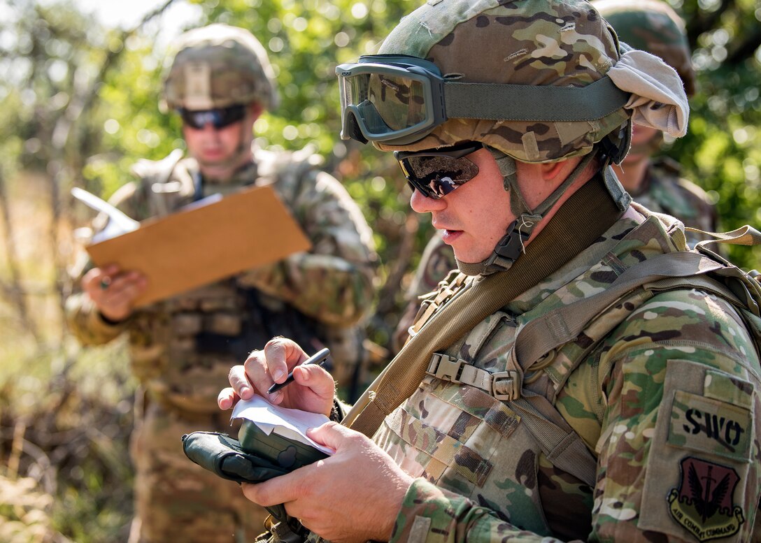 Staff Weather Officers from the 3d Weather Squadron plot out coordinates during a certification field exercise (CFX), July 31, 2019, at Camp Bowie Training Center, Texas. The CFX was designed to evaluate the squadron’s overall tactical ability and readiness to provide the U.S. Army with full spectrum environmental support to the Joint Task Force (JTF) fight. The CFX immersed Airmen into all the aspects of what could come with a deployment such as Land Navigation. (U.S. Air Force photo by Airman 1st Class Eugene Oliver)