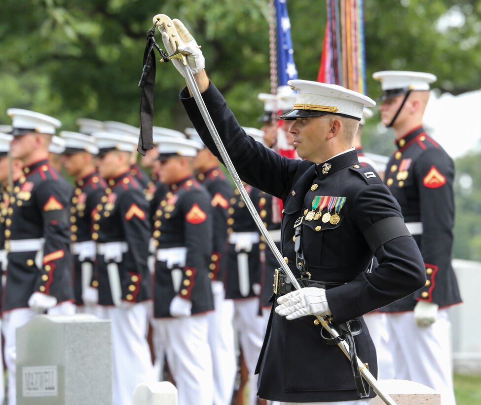Captain Taylor Paul, platoon commander, Bravo Company, Marine Barracks Washington, D.C., conducts “return sword” during a full honors funeral for Maj. Matthew M. Wiegand at Arlington National Cemetery, Arlington, Virginia, Aug. 15, 2019. Wiegand, an Ambler, Pennsylvania native, commissioned as a second lieutenant in 2008 and served 11 faithful years as a pilot and flight instructor. Wiegand passed away on March 30, 2019 during a night training accident. (U.S. Marine Corps photo by Sgt. Robert Knapp/Released)