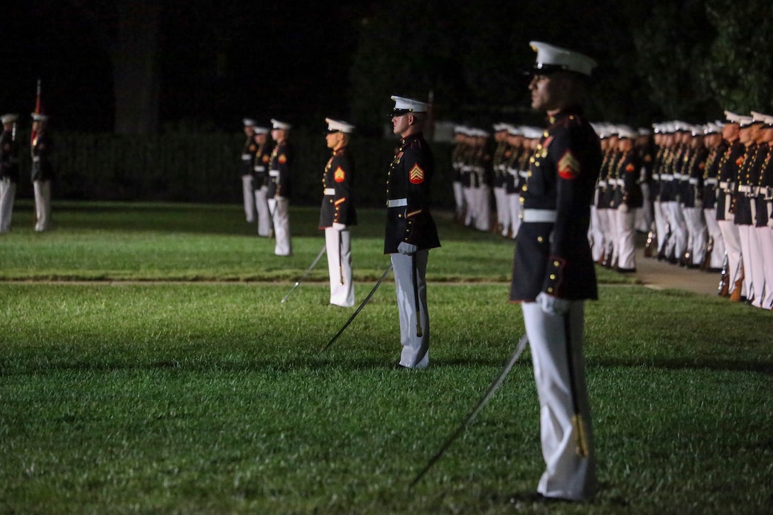 Noncommissioned officers with Marine Barracks Washington, D.C., fulfill the role of platoon commanders during the Noncommissioned Officer Friday Evening Parade at Marine Barracks Washington, D.C., Aug. 16, 2019. The hosting official for the evening was Lt. Gen. John J. Broadmeadow, director of Marine Corps Staff and the Under Secretary of the Navy, the Honorable Mr. Thomas B. Modly, was the guest of honor. (U.S. Marine Corps photo by Sgt. Robert Knapp/Released)