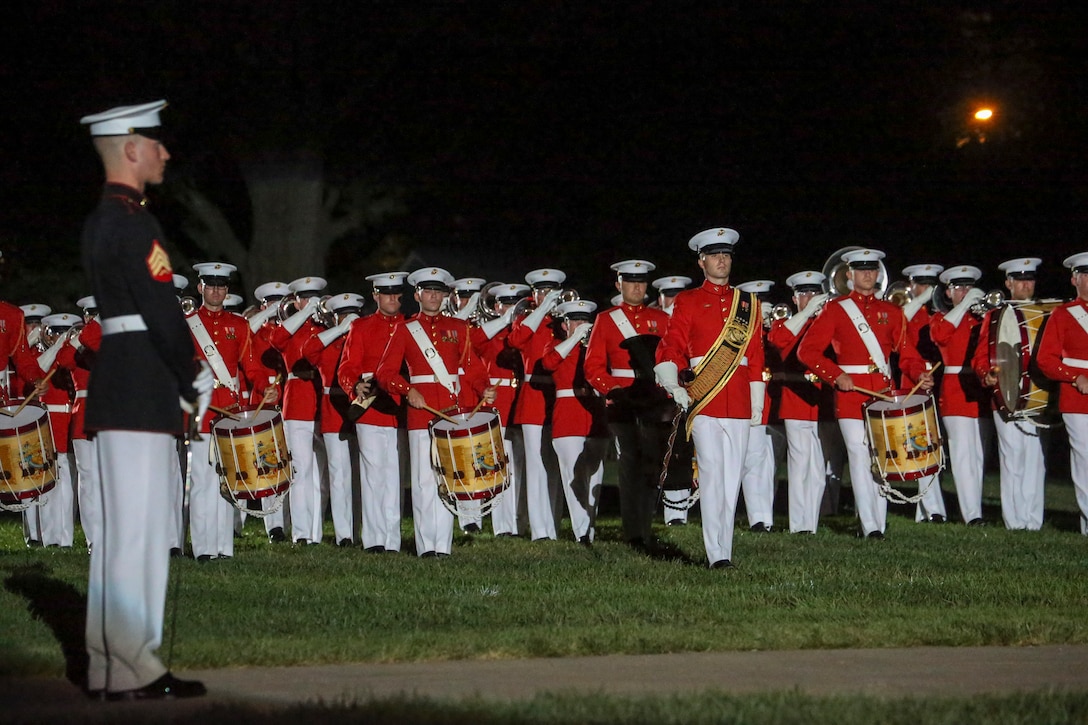 Sergeant Cody Hotto, acting drum major, “The Commandant’s Own” U.S. Marine Drum and Bugle Corps, marches across the parade deck during the Noncommissioned Officer Friday Evening Parade at Marine Barracks Washington, D.C., Aug. 16, 2019. The hosting official for the evening was Lt. Gen. John J. Broadmeadow, director of Marine Corps Staff and the Under Secretary of the Navy, the Honorable Mr. Thomas B. Modly, was the guest of honor. (U.S. Marine Corps photo by Sgt. Robert Knapp/Released)