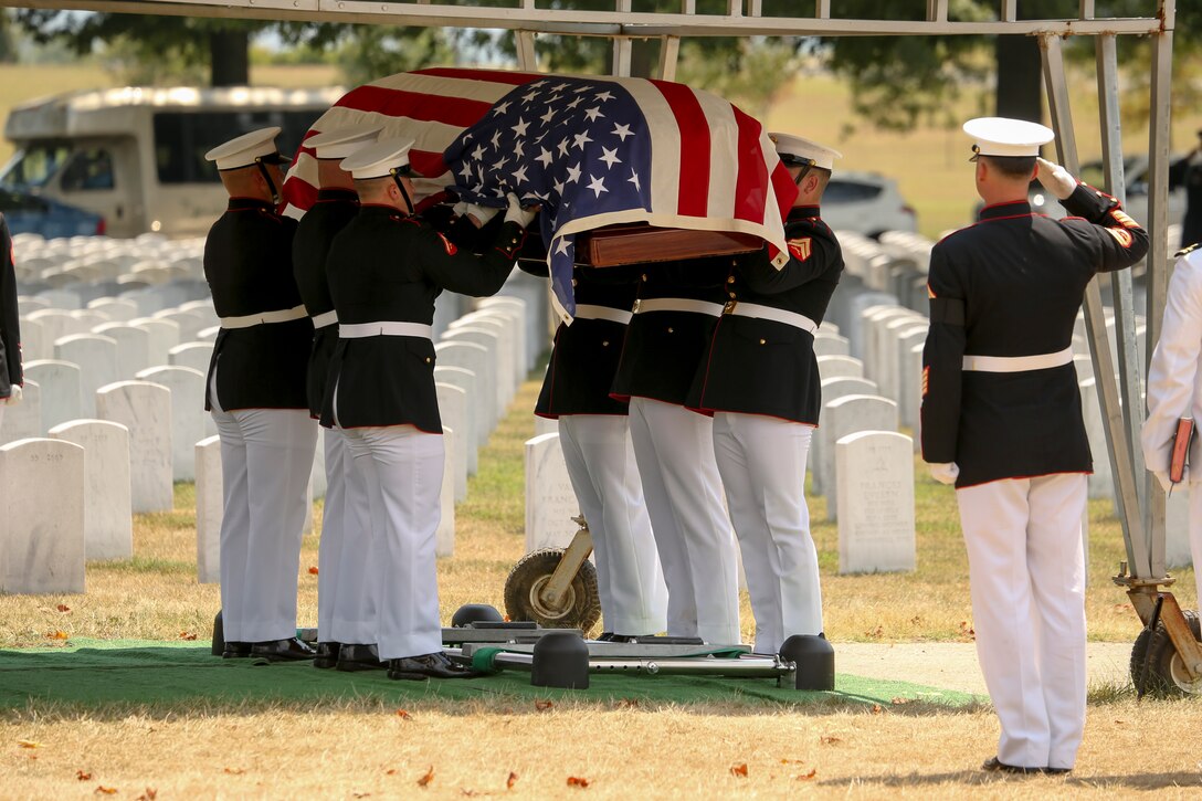 Body Bearers with Bravo Company, Marine Barracks Washington, D.C., perform the “final raise” for Maj. Gen. Ronald L. Beckwith during a full honors funeral at Arlington National Cemetery, Arlington, Virginia, Aug. 7, 2019. Beckwith commissioned as a second lieutenant in the Marine Corps in 1957 and served several combat tours in Vietnam as a combat aviator. Beckwith retired from the Marine Corps in 1991 after 34 years of service and passed away on Feb. 19, 2019. (U.S. Marine Corps photo by Pfc Allen Sanders)