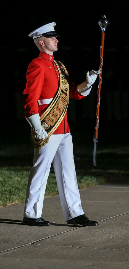 Sergeant Cody Hutto, acting drum major, “The Commandant’s Own” U.S. Marine Drum and Bugle Corps, marches across the parade deck during the Noncommissioned Officer Friday Evening Parade at Marine Barracks Washington, D.C., Aug. 16, 2019. The hosting official for the evening was Lt. Gen. John J. Broadmeadow, director of Marine Corps Staff and the Under Secretary of the Navy, the Honorable Mr. Thomas B. Modly, was the guest of honor. (U.S. Marine Corps photo by Pfc. Allen Sanders)