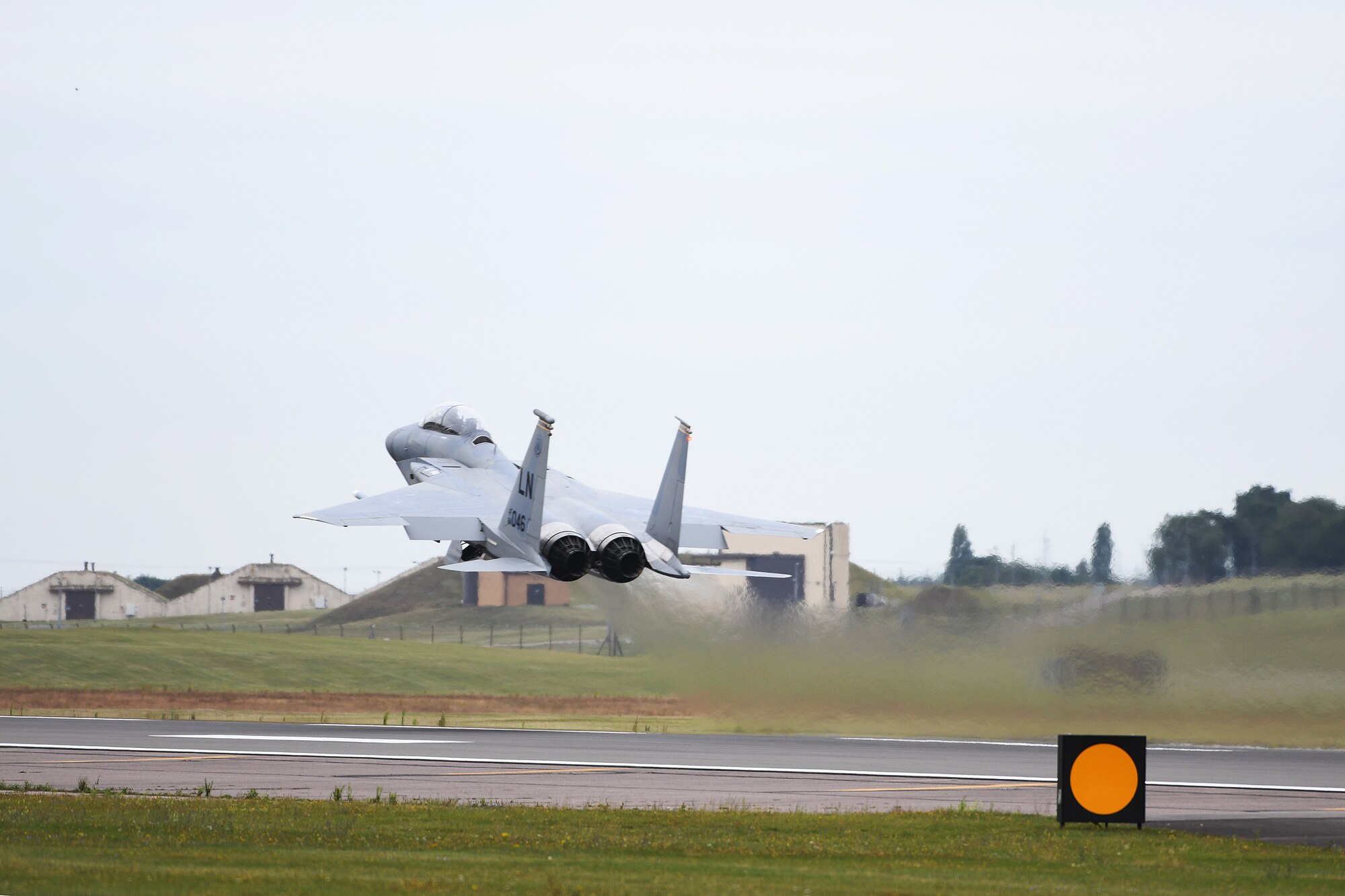 An F-15C Eagle assigned to the 493rd Fighter Squadron takes off on the flightline at Royal Air Force Lakenheath, England, Aug. 16, 2019. U.S. Air Force Staff Sgt. Derreck Day, 48th Operations Support Squadron Survival, Evasion, Resistance and Escape specialist, was notified that he was to receive a familiarization orientation flight and later found out that his pilot would be his high school friend, U.S. Air Force Capt. Caleb Wyatt, 493rd Fighter Squadron F-15C Eagle electronic combat pilot. (U. S. Air Force photo by Airman 1st Class Shanice Williams-Jones)