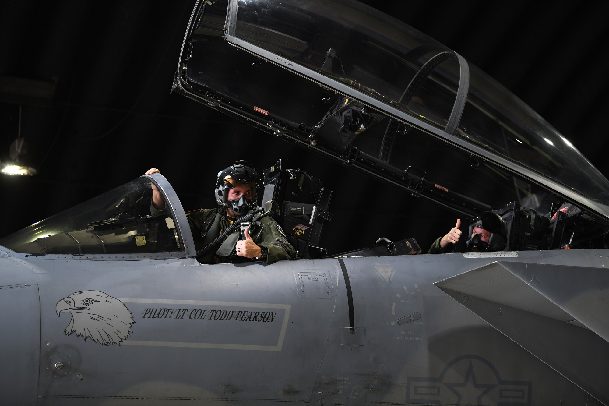 U.S. Air Force Staff Sgt. Derreck Day, 48th Operations Support Squadron Survival, Evasion, Resistance and Escape specialist, returns a thumbs up from U.S. Air Force Capt. Caleb Wyatt, 493rd Fighter Squadron F-15C Eagle electronic combat pilot, before a familiarization orientation flight at Royal Air Force Lakenheath, England, Aug. 16, 2019. Familiarization flights allow individuals who normally have aviation-related responsibilities with aircraft and missions an opportunity to experience flying in an aircraft. (U. S. Air Force photo by Airman 1st Class Shanice Williams-Jones)