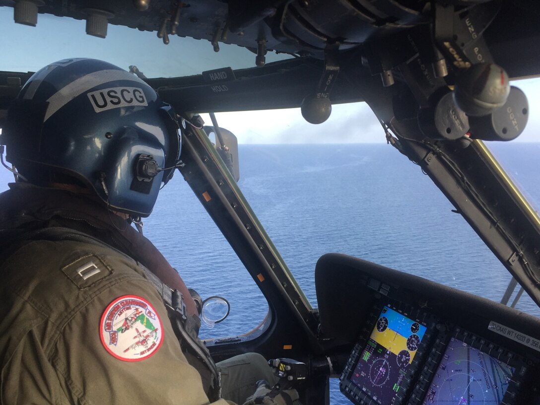 An HC-130 Hercules aircraft crew from Coast Guard Air Station Clearwater searches for two boaters August 19, 2019, off the coast of Jacksonville, Florida.