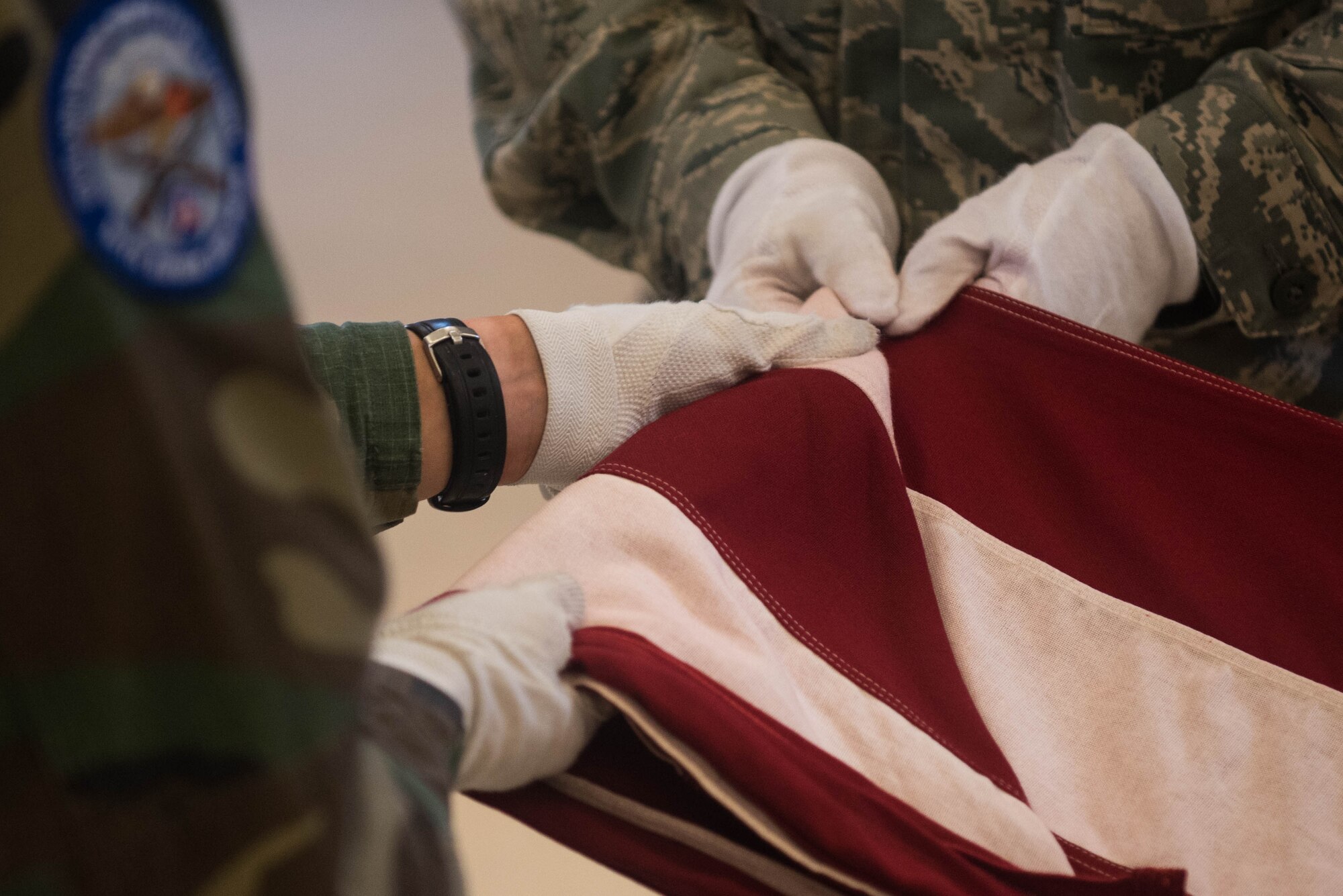 Members of the Civil Air Patrol fold the U.S. Flag at Joint Base Langley-Eustis, Virginia, July 17, 2019. Cadets and senior members of CAP gathered at Joint Base Langley-Eustis for the 2019 Mid-Atlantic Honor Guard Academy which has been held in various locations every year since its inception in 2003. (U.S. Air Force photo by Airman 1st Class Marcus M. Bullock)