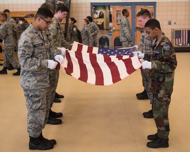 Members of the Civil Air Patrol fold the U.S. Flag at Joint Base Langley-Eustis, Virginia, July 17, 2019. CAP has 52 wings which includes every state plus the National-Capitol Wing of Washington, D.C., and the Puerto Rico Wing. (U.S. Air Force photo by Airman 1st Class Marcus M. Bullock)