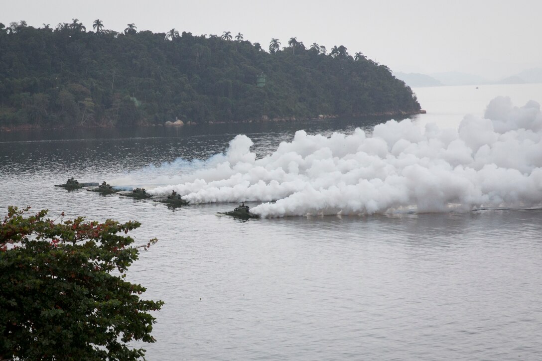 Marine amphibious assault vehicles in the water.