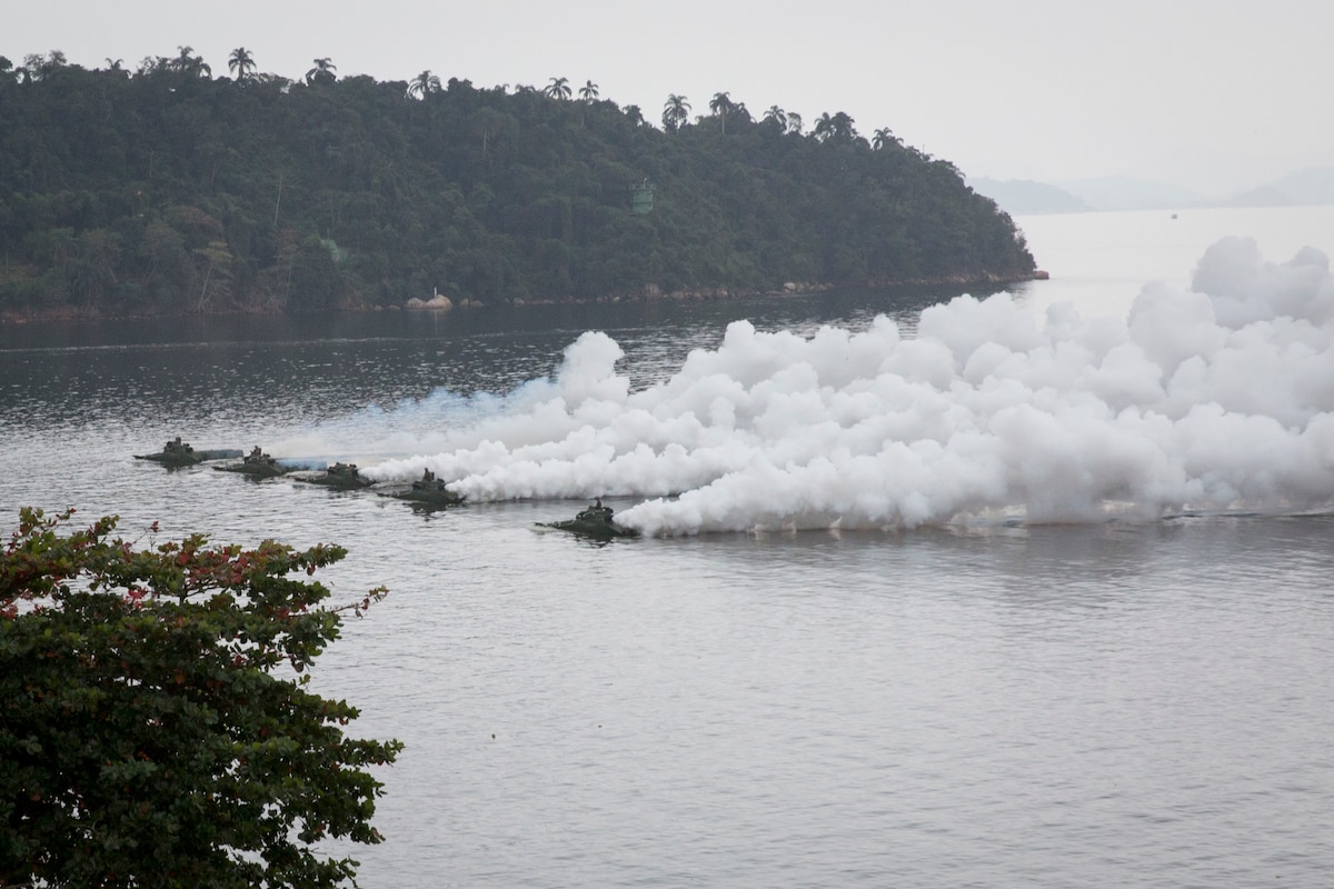 Marine amphibious assault vehicles in the water.