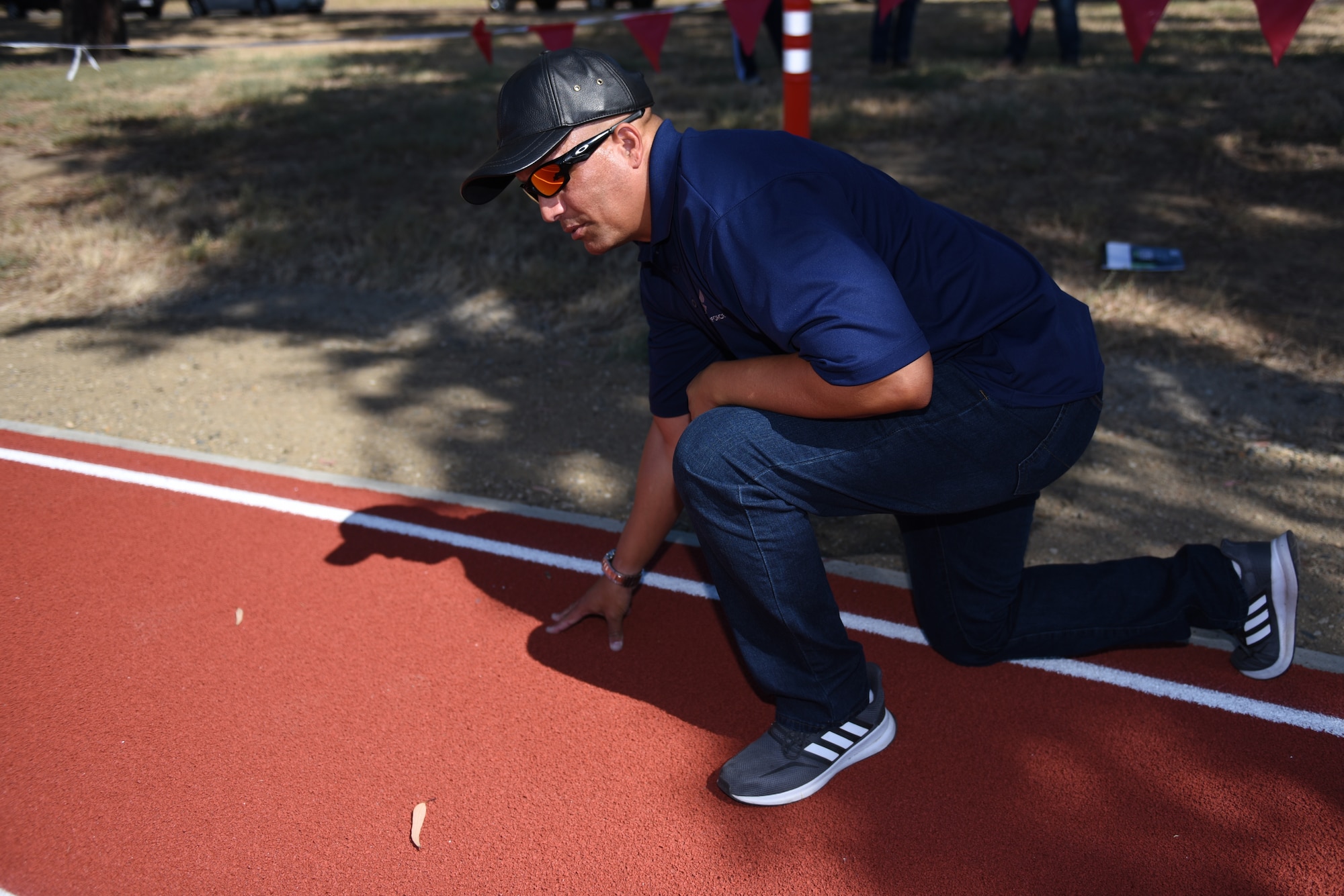 Brian Armstrong, 60th Contracting Squadron contracting officer, inspects the North Gate Track for potholes, tears and divots Aug. 15, 2019, at Travis Air Force Base, California. The track recently underwent renovations. The track was inspected to ensure it met the Air Force’s standards for safe use. (U.S. Air Force photo by Airman 1st Class Cameron Otte)