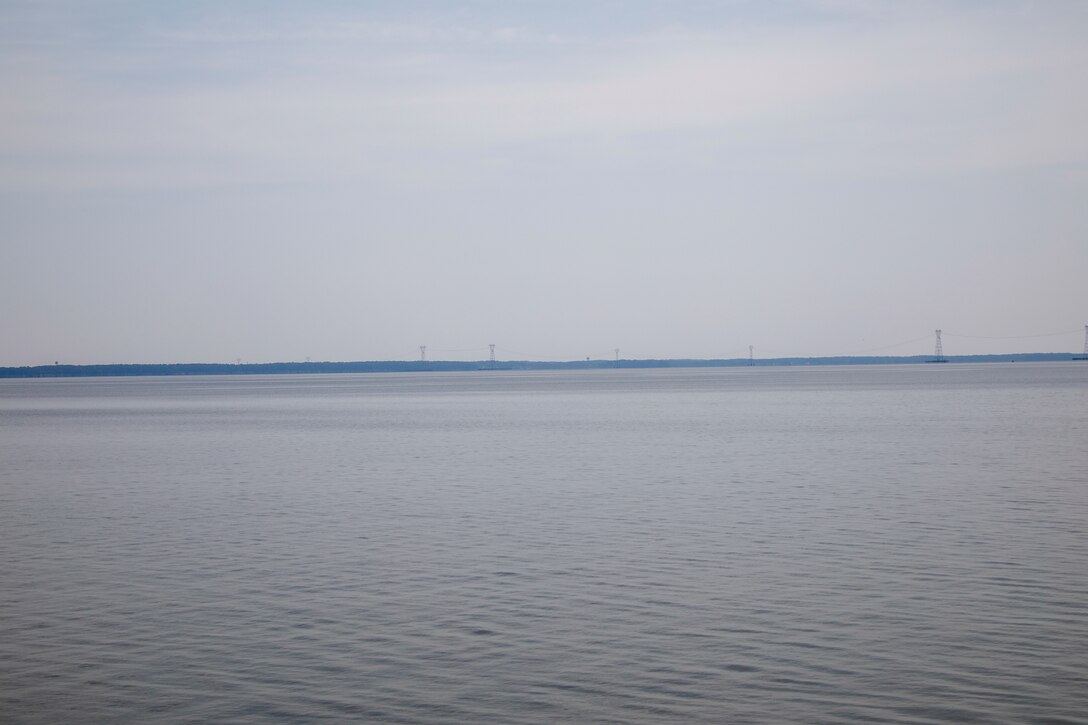 This photo is a view of the the Skiffes Creek power lines from the Colonial Parkway at  37°13'10.75"N;  76°41'55.54"W. A 70mm focal length was used, as this best matched up what the human eye was seeing and what was being viewed through the viewfinder of a full frame camera.