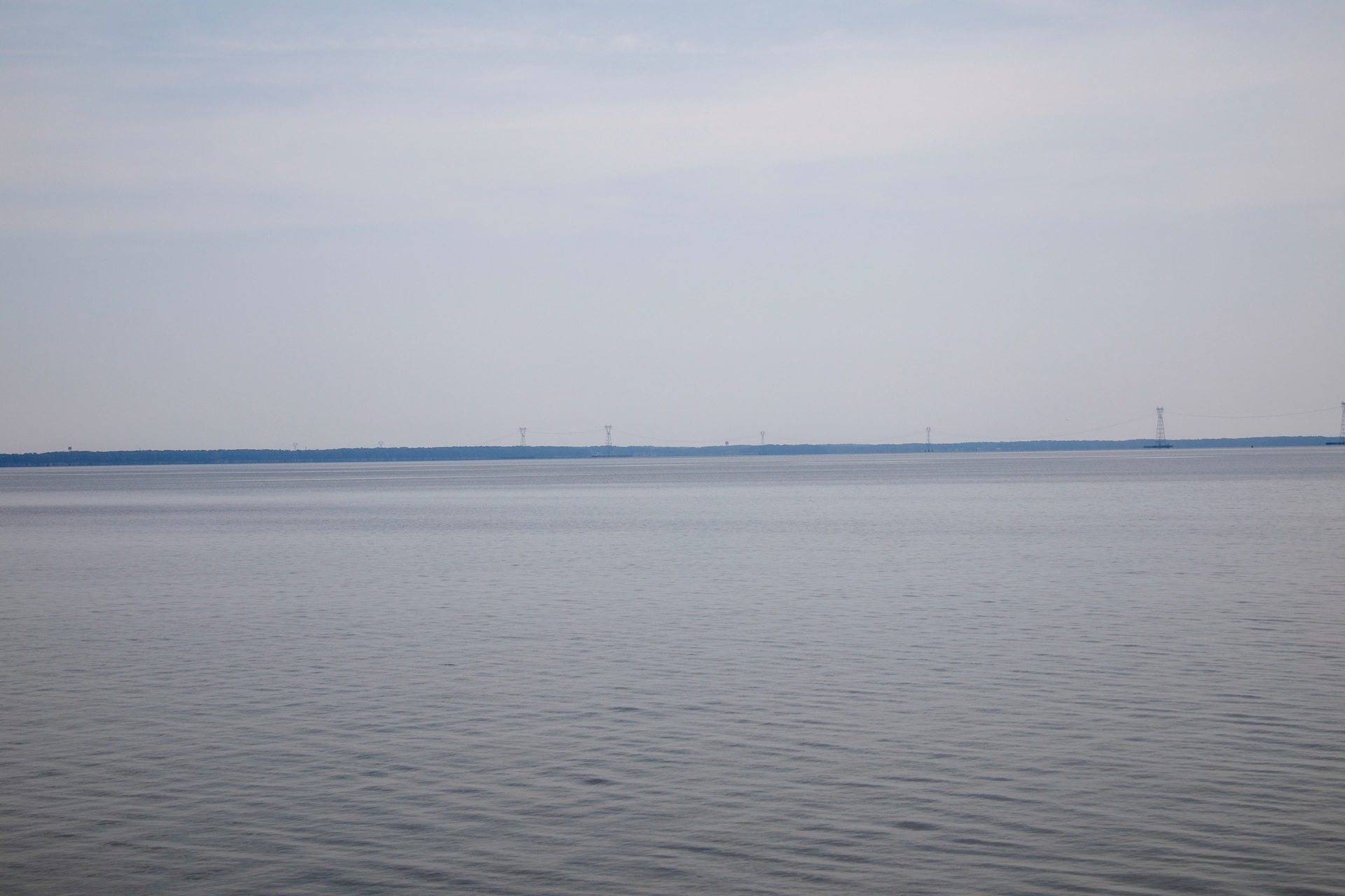 This photo is a view of the the Skiffes Creek power lines from the Colonial Parkway at  37°13'10.75"N;  76°41'55.54"W. A 70mm focal length was used, as this best matched up what the human eye was seeing and what was being viewed through the viewfinder of a full frame camera.