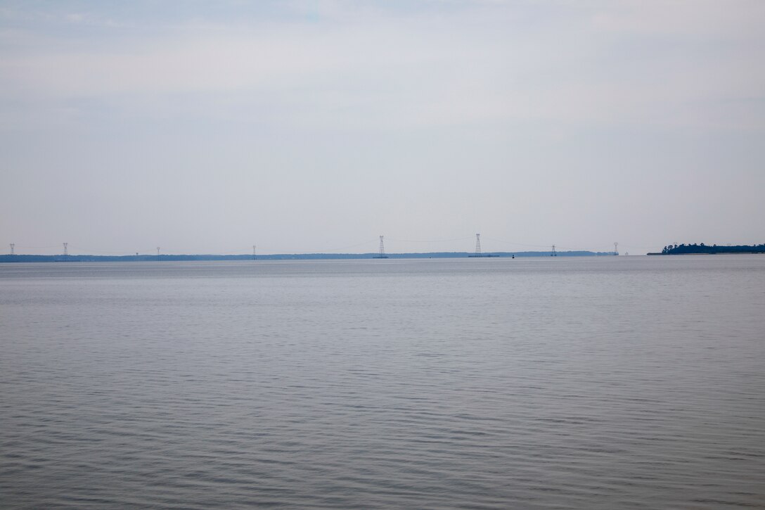 This photo is a view of the Skiffes Creek power lines from the Colonial Parkway at  37°13'10.75"N;  76°41'55.54"W. A 70mm focal length was used, as this best matched up what the human eye was seeing and what was being viewed through the viewfinder of a full frame camera.