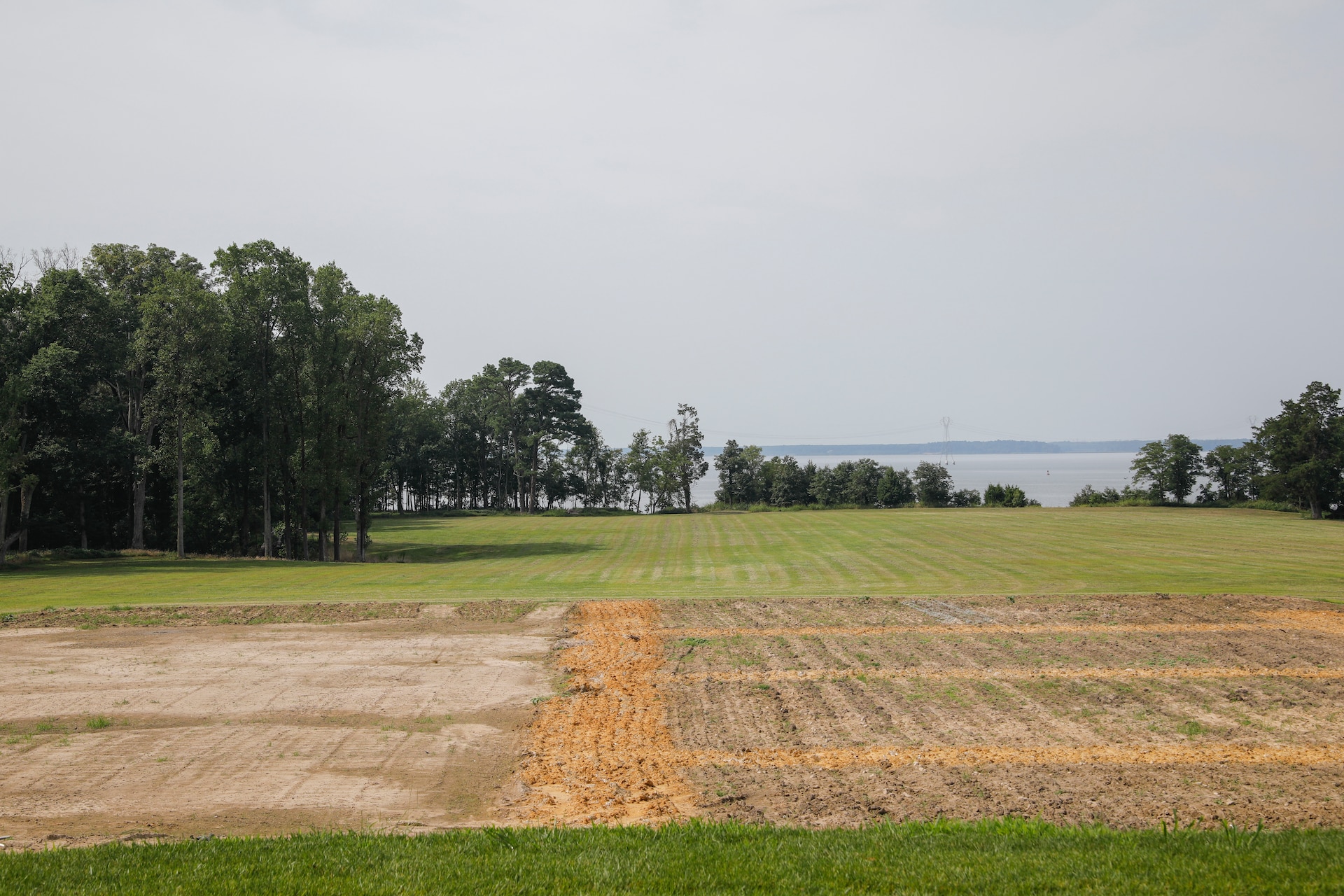 This photograph was taken from the middle of the back patio of the Carters Grove Plantation at   37°12'24.64"N;   76°37'29.51"W. A 70mm focal length was used as this best matched up the size of the towers through the viewfinder on a full frame camera with what the human eye was seeing at the location.