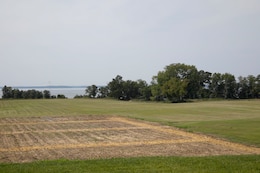 This photograph was taken from the middle of the back patio of the Carters Grove Plantation at   37°12'24.64"N;   76°37'29.51"W. A 70mm focal length was used as this best matched up the size of the towers through the viewfinder on a full frame camera with what the human eye was seeing at the location.