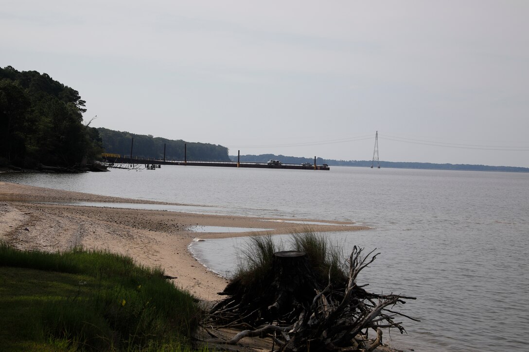 This image was taken along the shoreline at 37,11'58.24"N 76,37'26.03"W, which is on the Carters Grove Plantation property. A 75mm focal length was used as this best matched up the size of the towers  through the viewfinder on a full frame camera with what the human eye was seeing at the location.